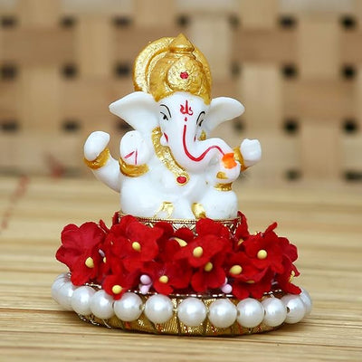 Elegant Lord Ganesha idol made of resin, measuring 8.9 cm x 8.9 cm x 8.9 cm, symbolizing prosperity and wisdom, ideal for home and car decor.
