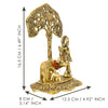 Intricate Lord Krishna showpiece in metal, depicting the deity playing the flute under a tree, surrounded by a golden cow and calf.
