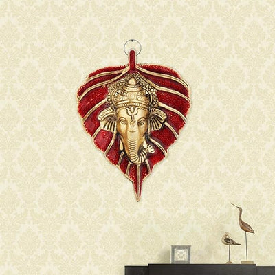 Handmade Ganesha wall hanging in aluminum, symbolizing wisdom and prosperity, ideal for home decor and spiritual spaces.