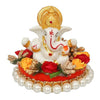 Handmade Lord Ganesha idol on a decorative plate, crafted from resin. Dimensions 8.9x8.9x7.6 cm, weighing 400g. Ideal for home decor and gifting.