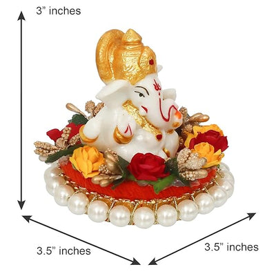 Handmade Lord Ganesha idol on a decorative plate, crafted from resin. Dimensions 8.9x8.9x7.6 cm, weighing 400g. Ideal for home decor and gifting.
