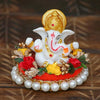 Handmade Lord Ganesha idol on a decorative plate, crafted from resin. Dimensions 8.9x8.9x7.6 cm, weighing 400g. Ideal for home decor and gifting.