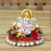 Handmade Lord Ganesha idol on a decorative plate, crafted from resin. Dimensions 8.9x8.9x7.6 cm, weighing 400g. Ideal for home decor and gifting.