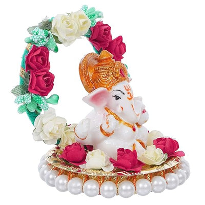 Handmade Lord Ganesha idol on a floral throne, crafted from resin. Dimensions: 9x9x9.5 cm, weight: 250g. Ideal for home decor and gifting.