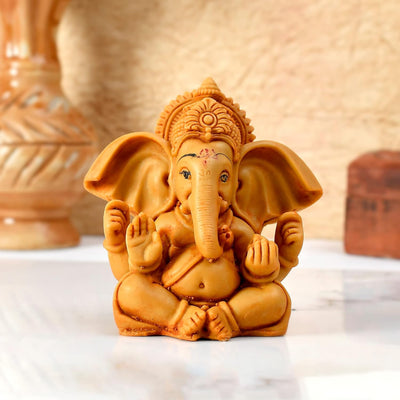 Handmade Ganesha idol in resin for car dashboards, symbolizing prosperity and protection during travel. Compact and stylish design.