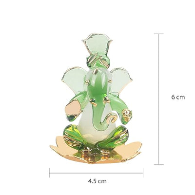 A handmade glass Ganesha idol, 4.5 cm x 6 cm, designed for car dashboards, showcasing intricate detailing and a spiritual aura.
