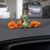 A handmade glass Ganesha idol, 4.5 cm x 6 cm, designed for car dashboards, showcasing intricate detailing and a spiritual aura.
