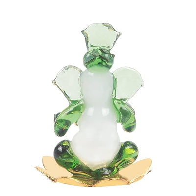 A handmade glass Ganesha idol, 4.5 cm x 6 cm, designed for car dashboards, showcasing intricate detailing and a spiritual aura.