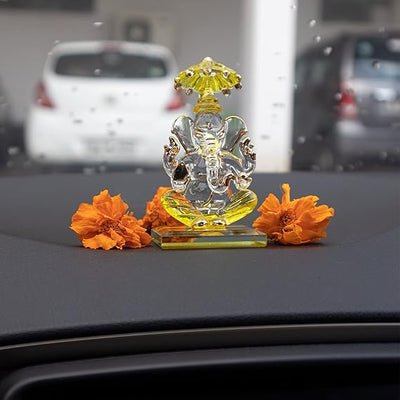 A beautiful handcrafted glass Ganesha idol, measuring 5 cm x 5 cm x 9 cm, ideal for car dashboards or home altars