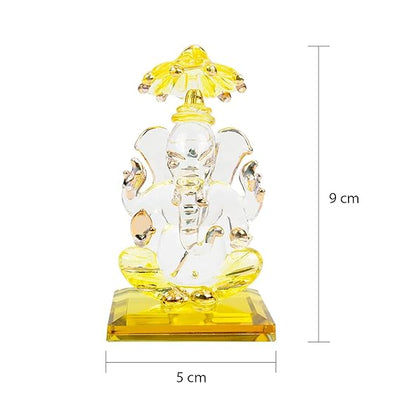 A beautiful handcrafted glass Ganesha idol, measuring 5 cm x 5 cm x 9 cm, ideal for car dashboards or home altars