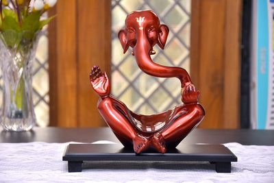 Handmade wooden Ganesha idol, symbolizing prosperity and wisdom, ideal for home altars and decorative displays.