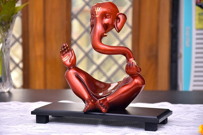 Handmade wooden Ganesha idol, symbolizing prosperity and wisdom, ideal for home altars and decorative displays.