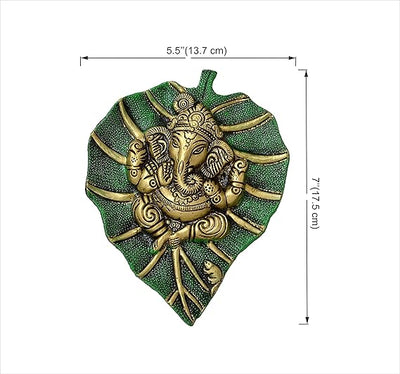 Handmade Ganesha metal wall hanging, symbolizing wisdom and prosperity, perfect for home decor and spiritual spaces.