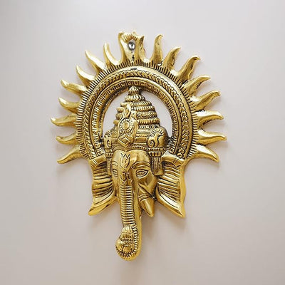 Handmade Ganesha metal wall hanging, symbolizing wisdom and prosperity, perfect for home decor and spiritual spaces.