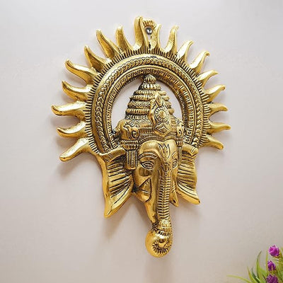 Handmade Ganesha metal wall hanging, symbolizing wisdom and prosperity, perfect for home decor and spiritual spaces.