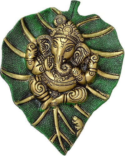 Handmade Ganesha metal wall hanging, symbolizing wisdom and prosperity, perfect for home decor and spiritual spaces.
