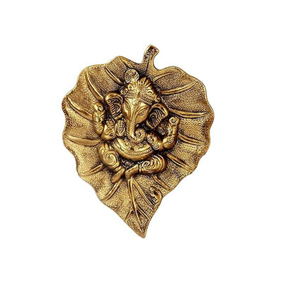 Handmade Ganesha wall hanging in metal, symbolizing wisdom and prosperity, perfect for home decor and altars.