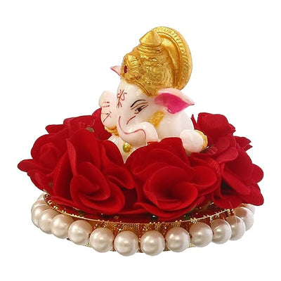 Handmade Lord Ganesha idol on a vibrant red floral plate, crafted from resin. Dimensions: 9x9x8 cm, weight: 250g. Ideal for home decor and gifting.