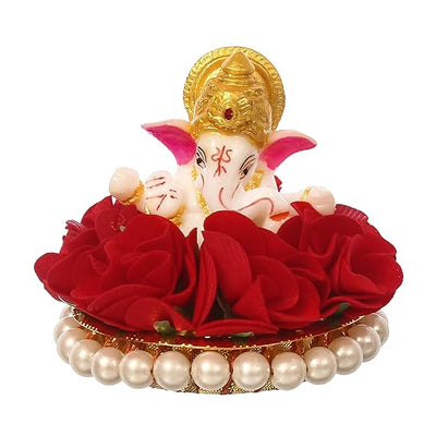 Handmade Lord Ganesha idol on a vibrant red floral plate, crafted from resin. Dimensions: 9x9x8 cm, weight: 250g. Ideal for home decor and gifting.