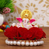 Handmade Lord Ganesha idol on a vibrant red floral plate, crafted from resin. Dimensions: 9x9x8 cm, weight: 250g. Ideal for home decor and gifting.