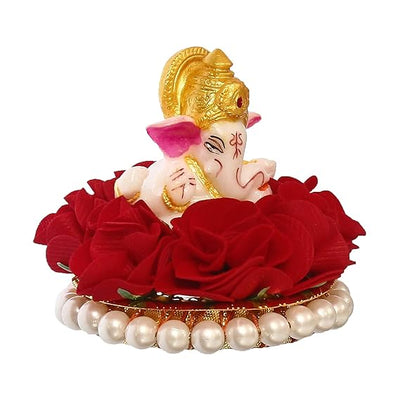 Handmade Lord Ganesha idol on a vibrant red floral plate, crafted from resin. Dimensions: 9x9x8 cm, weight: 250g. Ideal for home decor and gifting.