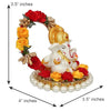 Handmade Lord Ganesha idol on a handcrafted rose flower plate, made of resin. Dimensions 10x8x8 cm, weighing 300g. Ideal for home decor and gifting.