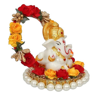 Handmade Lord Ganesha idol on a handcrafted rose flower plate, made of resin. Dimensions 10x8x8 cm, weighing 300g. Ideal for home decor and gifting.