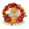 Handmade Lord Ganesha idol on a handcrafted rose flower plate, made of resin. Dimensions 10x8x8 cm, weighing 300g. Ideal for home decor and gifting.