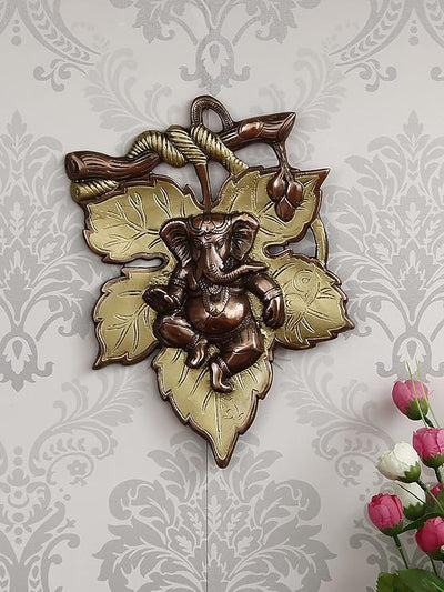 Handmade Ganesha wall hanging idol in iron, symbolizing prosperity and wisdom, perfect for home decor and altars.