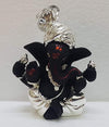 Handmade ceramic Ganesha idol for car dashboard, measuring 5.1cm x 3.6cm x 7.6cm, showcasing intricate details and vibrant colors.
