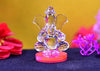 A beautifully crafted Ganesha idol made of glass, featuring intricate details, ideal for display on a car dashboard or altar.
