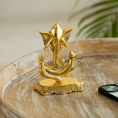 Handmade metal Ganesha idol, 13.2 cm x 16.8 cm, perfect for altars, home decor, or car dashboards, symbolizing prosperity and wisdom.