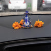 A beautifully crafted glass Ganesha idol, showcasing intricate details, ideal for home decor or car dashboards.