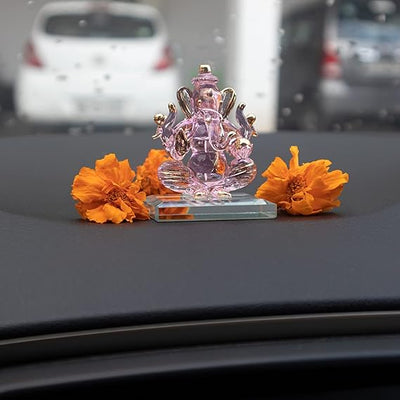 Handcrafted glass Ganesha idol, 6.5x5x5 cm, 300 grams, ideal for car dashboard or home altar, symbolizing wisdom and prosperity.