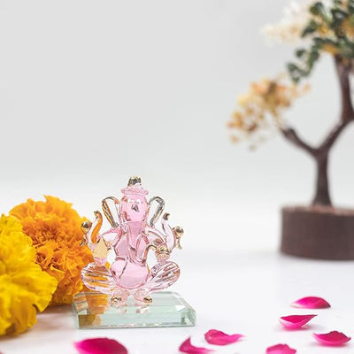 Handcrafted glass Ganesha idol, 6.5x5x5 cm, 300 grams, ideal for car dashboard or home altar, symbolizing wisdom and prosperity.