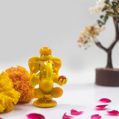 Handmade glass Ganesha statue, 8x5 cm, ideal for car dashboard or home altar. Symbolizes wisdom, success, and divine blessings.