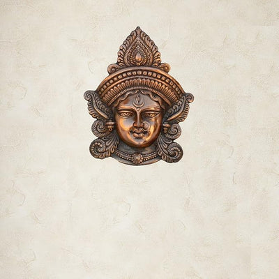 Handmade brown metal sculpture of Goddess Durga, showcasing intricate details, designed for wall hanging, ideal for home or temple decor.