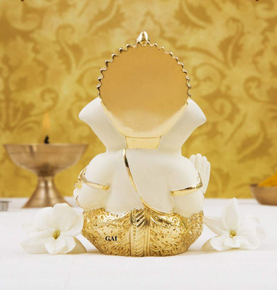 Handcrafted Gold-Crowned Ganesha idol made of gold-plated ceramic, symbolizing prosperity and success, ideal for home decor and altars.