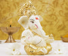 Handcrafted Gold-Crowned Ganesha idol made of gold-plated ceramic, symbolizing prosperity and success, ideal for home decor and altars.