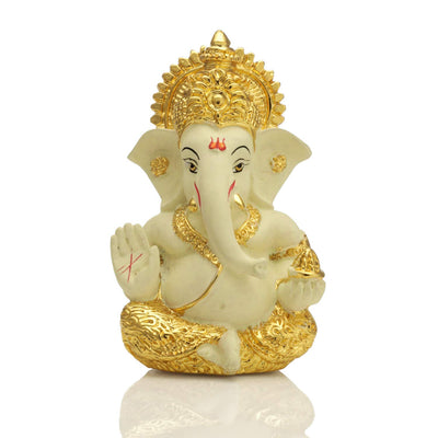 Handcrafted gold-plated Ganesha idol made of ceramic, symbolizing protection and good fortune, ideal for car interiors and altars.