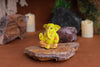 Gold-plated Lord Ganesha idol made of resin, symbolizing prosperity and success. Ideal for home, office, or car decor, showcasing intricate details."