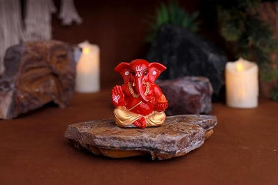 A premium gold-plated Lord Ganesha idol, meticulously crafted from resin, measuring 5L x 5W x 5H cm. Ideal for home, office, or car decor.