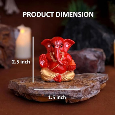 A premium gold-plated Lord Ganesha idol, meticulously crafted from resin, measuring 5L x 5W x 5H cm. Ideal for home, office, or car decor.