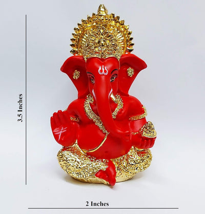 Handcrafted Ganesha idol with a gold base and red terracotta finish, symbolizing prosperity and wisdom, ideal for altars and home decoration.