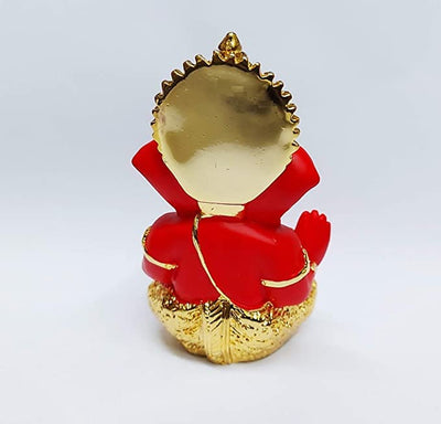 Handcrafted Ganesha idol with a gold base and red terracotta finish, symbolizing prosperity and wisdom, ideal for altars and home decoration.