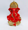 Handcrafted Ganesha idol with a gold base and red terracotta finish, symbolizing prosperity and wisdom, ideal for altars and home decoration.