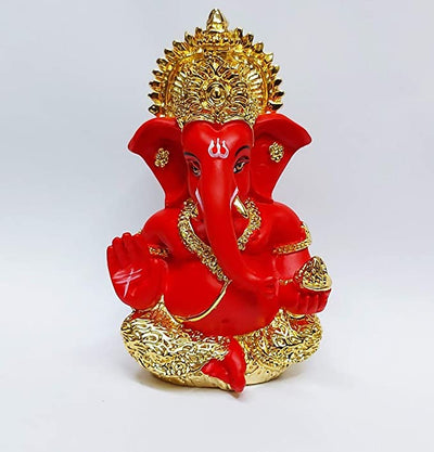 Handcrafted Ganesha idol with a gold base and red terracotta finish, symbolizing prosperity and wisdom, ideal for altars and home decoration.