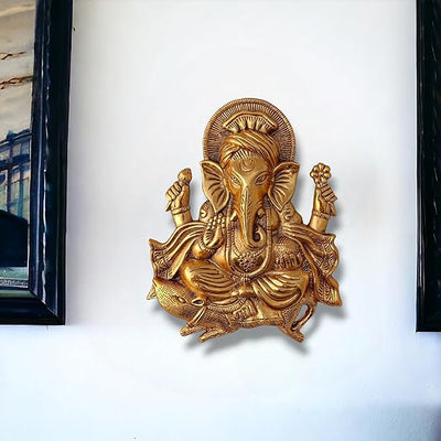 Handcrafted golden Ganesh idol wall hanging, made of metal, symbolizing prosperity and wisdom, 26 cm x 21 cm x 3 cm, perfect for home decor and altars.