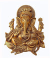 Handcrafted golden Ganesh idol wall hanging, made of metal, symbolizing prosperity and wisdom, 26 cm x 21 cm x 3 cm, perfect for home decor and altars.