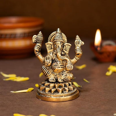 Handcrafted brass Ganesha idol, showcasing intricate details, ideal for home decor and spiritual practices, measuring 6L x 4.5W x 8.4H cm